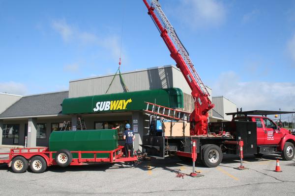 Subway awning being installed